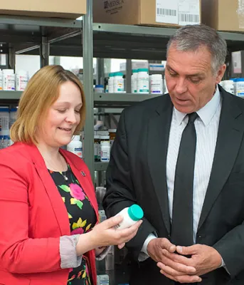 More drugs being covered by provincial government Photo shows four individuals standing in the provincial pharmacy