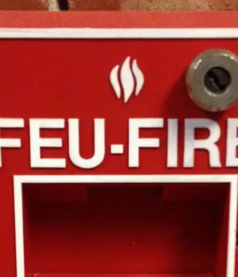 Fire drills Image of fire alarm mounted on a brick wall