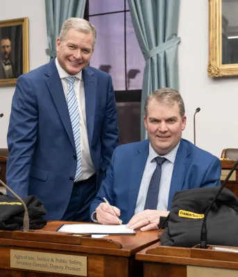 Minister Thompson and Minister McLane smiling next to each other