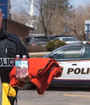 Man holding emergency supplies.