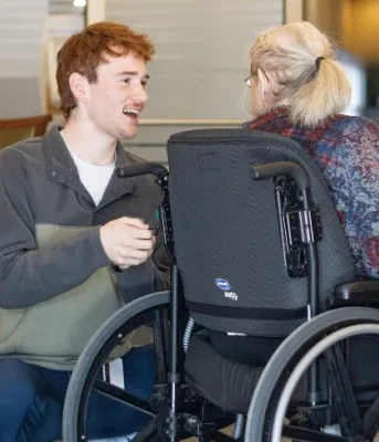 Program brings rehabilitation support to residents at Garden Home Image of youth talking to seinor in wheelchair