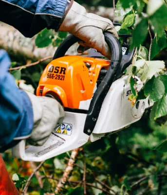 person using a chainsaw