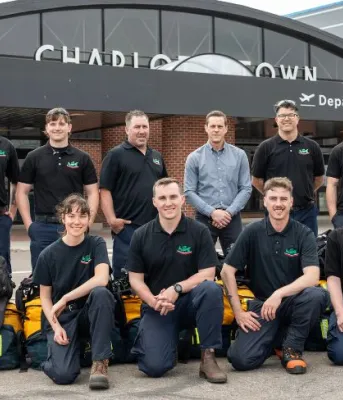 Rob Lantz with 10 wildfire fighters from PEI