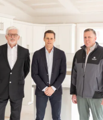 Partnership with Holland College adds to provincial housing supply image of three people standing in a kitchen of a new apartment