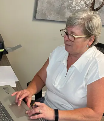 Inclusions East providing vital service with Independence Place image of a person at a desk using a computer