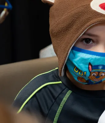First vaccine clinic held for children age 5 to 11; two new cases of COVID-19 image of a child with a mask on receiving his vaccination