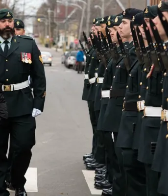 Throne Speech charts path forward for growing, diversified province Photo shows lieutenant governor reviewing honor guard