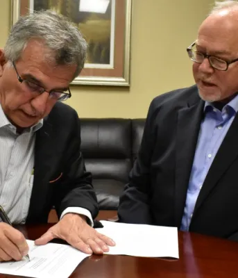 Minister Richard Brown and Maritime Electric CEO John Gaudet