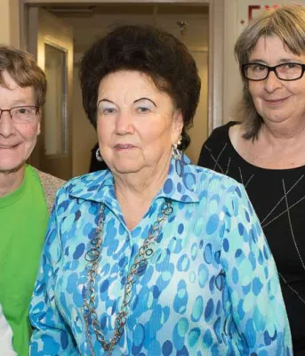 Applications being accepted for seniors grants Four senior women standing beside Minister Mundy.