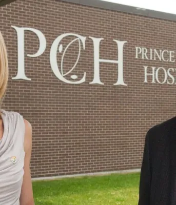 Minister Robert Henderson and Dr. Michele Barton outside Prince County Hospital Minister Robert Henderson and Dr. Michele Barton outside Prince County Hospital
