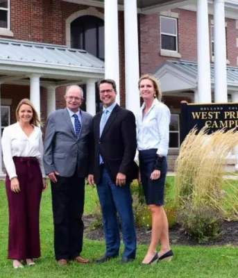 Human Services diploma at Holland College will be able to take the program on the West Prince Campus in Alberton beginning in January 2020 Image of officials in front of main building of Holland College, West Prince campus