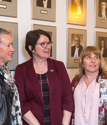 Nurses Jill Anne McDowall, Cynthia Bryanton, Anita MacKenzie and Debbie Flood-Vickerson speak with Minister Mitchell about nursing on PEI
