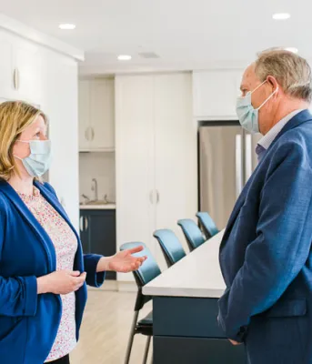 image of two people in a room