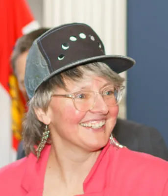 Meet PEI’s new Poet Laureate – Tanya Davis image of perso inside a home wearing a baseball style hat