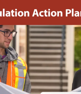PEI Population Action Plan Image of two young professionals in an office setting with text: PEI Population Action Plan