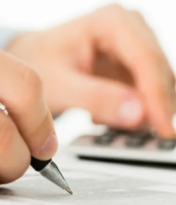 iStock image - copyright iStock image of person using calculator with PEI wordmark