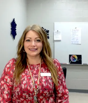 image of a person standing in a school office