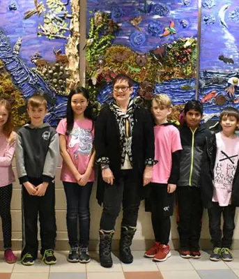 Minister Jordan Brown with artist Dina Blot, West Royalty Elementary teacher Tracey Smith and students Minister Jordan Brown with artist Dina Blot, West Royalty Elementary teacher Tracey Smith and students