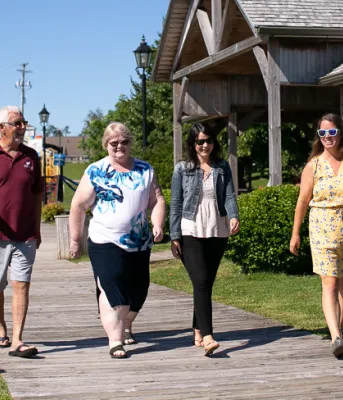 Three Rivers named PEI’s most active community in national ParticipACTION challenge image of four people walking on a wooden boardwalk