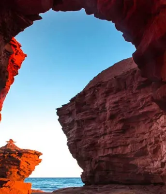 Island's 2017 tourism set to break records again Photo shows the natural archway at Thunder Cove