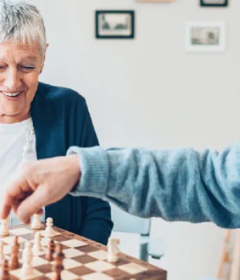 senior couple playing chess