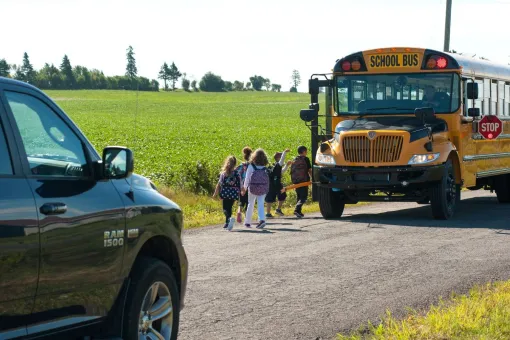 children about to get on a school bus